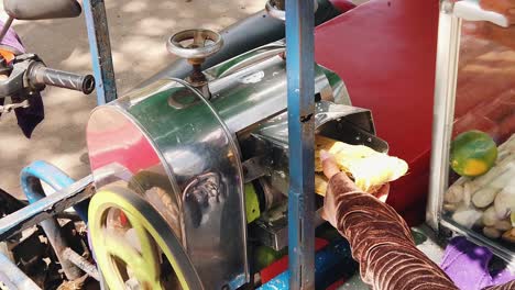 Slow-Motion-Shot-of-Sugar-Cane-in-a-Machine