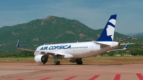 air corsica a320 neo is on the airport in ajaccio, corsica - tracking shot