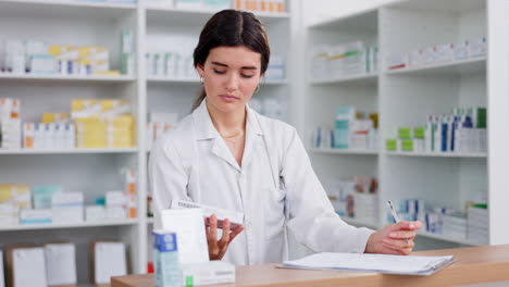a female pharmacist or clerk working behind