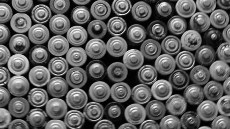 a large number of finger batteries a large number of finger batteries black and white image of batteries movement in a circle used aa batteries