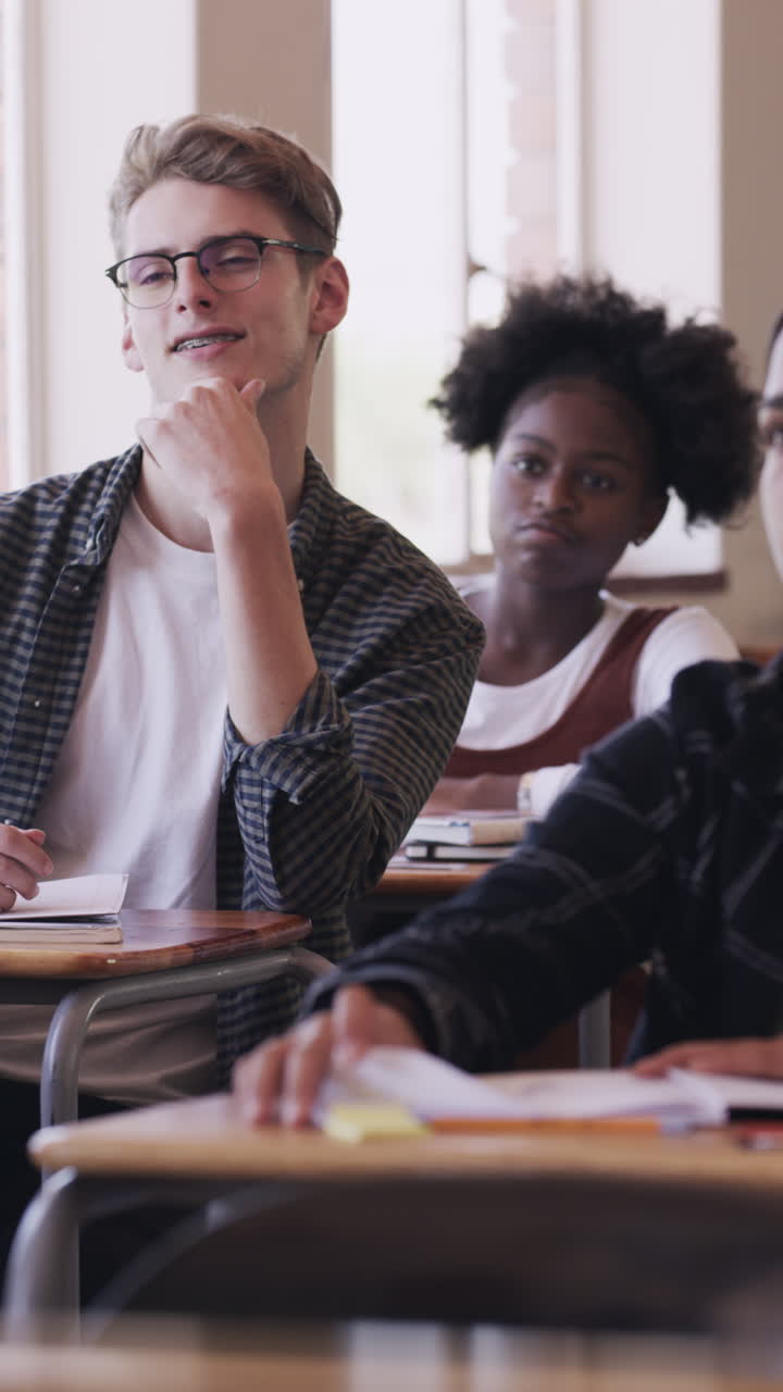 Young Students Raise Hands to Participate in Classroom Discussion