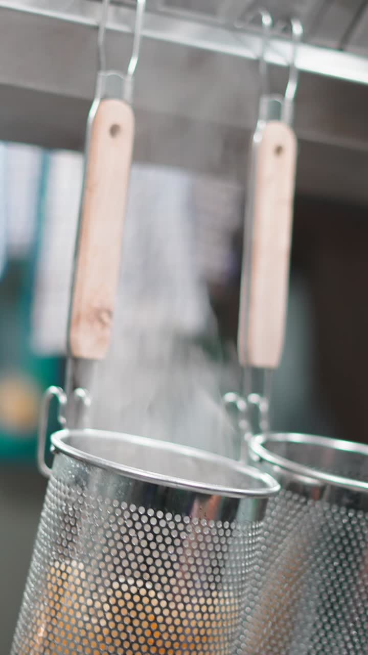 Kitchen scenes with hand, towel, and cooking equipment