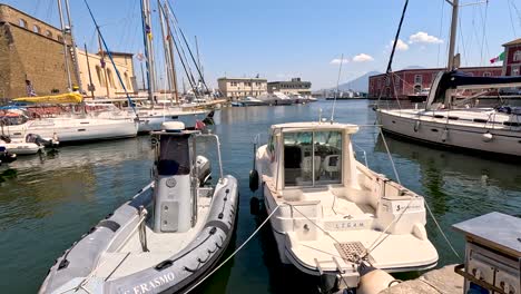 boats docked at a harbor in naples