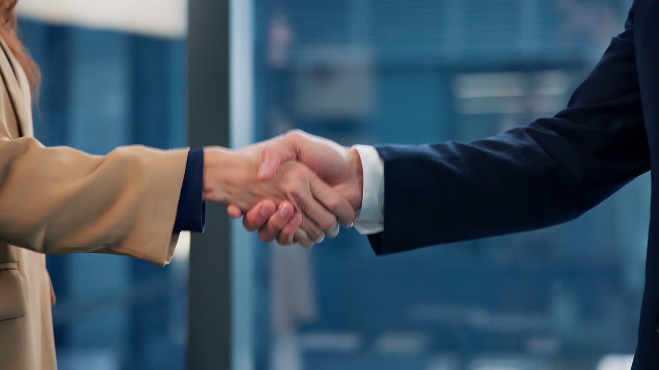 Business handshake in an office setting