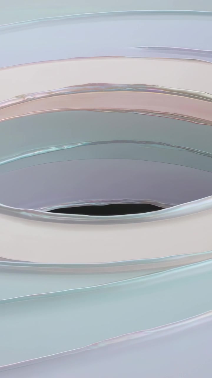 Vertical video: Moving camera showing layered glossy rings in studio, revealing dark aperture
