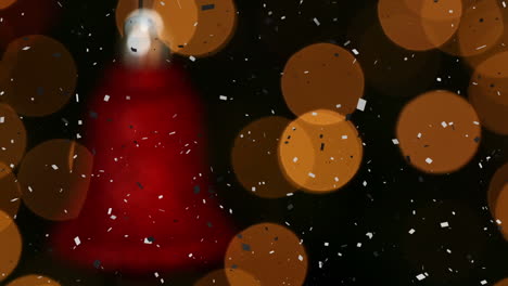 animación de confeti cayendo sobre la luz de la lente iluminada y la campana roja de navidad