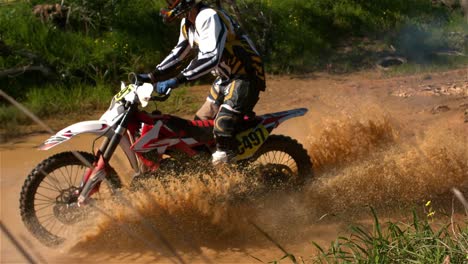 man riding a motor cross bike