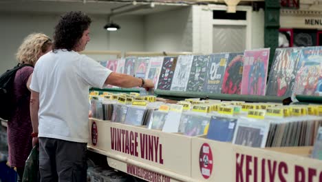 two people browsing records at a vintage vinyl shop