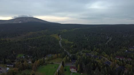 aerial drone shot of distant mountains with cloudy skies in iceland