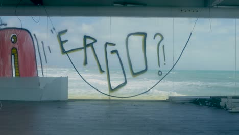graffiti-covered abandoned building with ocean view