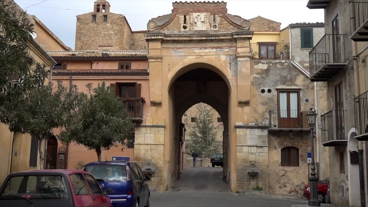 On of the access gates of Castelbuono, the town in Sicily famous for his panettone. The shot is on a cloudy, and windy winter day