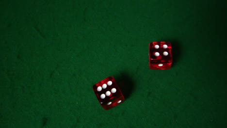 red dice falling on casino table