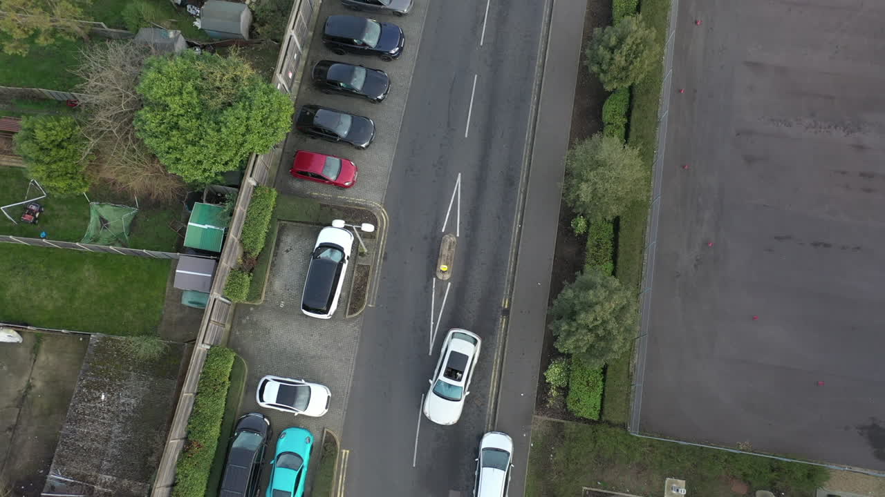 Aerial shot of white SUV on trade centre road