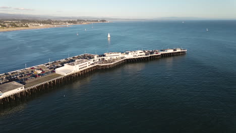 Aerial-view-of-Santa-Cruz-Boardwalk-and-Beach-California-with-surfers-shot-in-4k-high-resolution