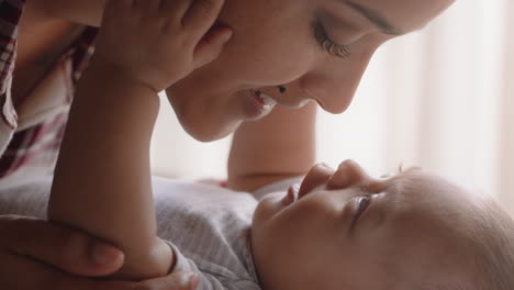 close up mother with baby nurturing happy toddler at home loving mom soothing infant