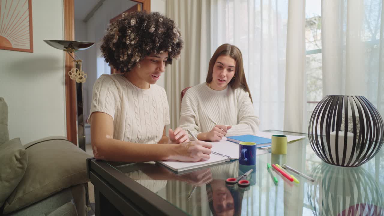 Two women drawing together at home