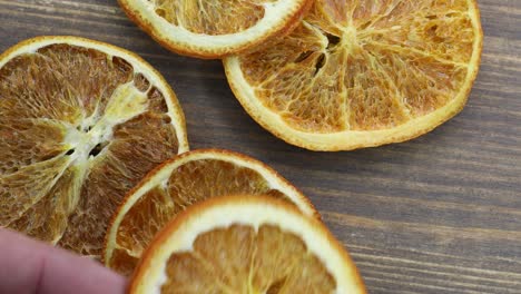 dried orange slices on a wooden background