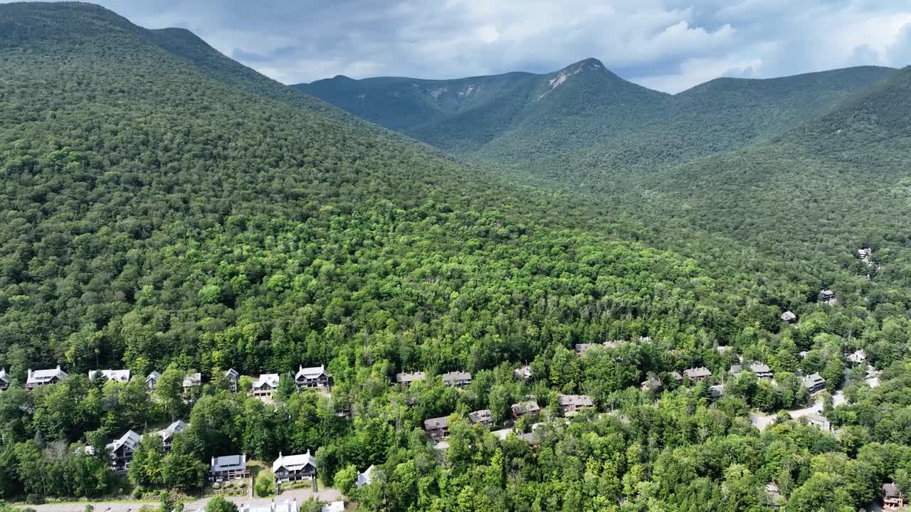 Drone view of houses in the White Mountains of New Hampshire during summer