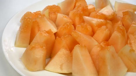 exotic melon fruit close-up. sliced melon on a white background