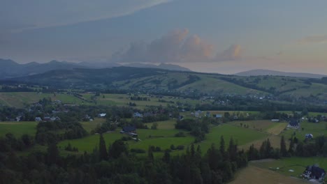 vista of villages surrounded by sloping mountains in dzianisz podhale, tatra county, lesser poland voivodeship, southern poland