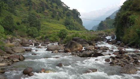 an amazing picturesque mountain landscape with a rushing river in the himalayan mountains of nepal