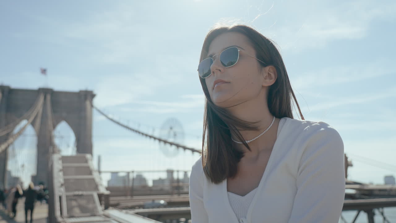 Woman enjoying the view of the Brooklyn Bridge
