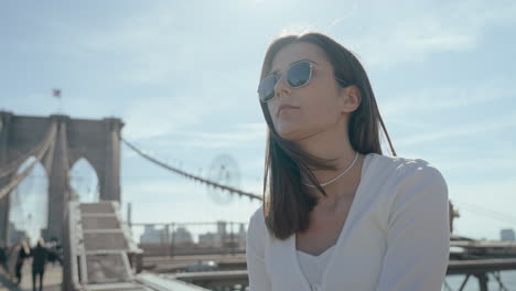 woman enjoying the view of the brooklyn bridge