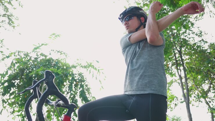 Cyclist Stretching Before Ride