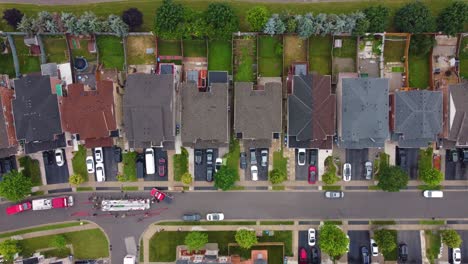 aerial-pov-of-a-neighborhood-road-filled-with-fire-department-emergency-vehicles