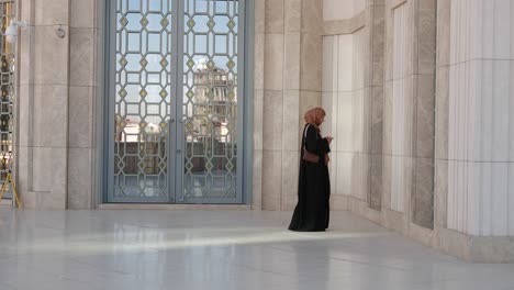 woman walking in a mosque