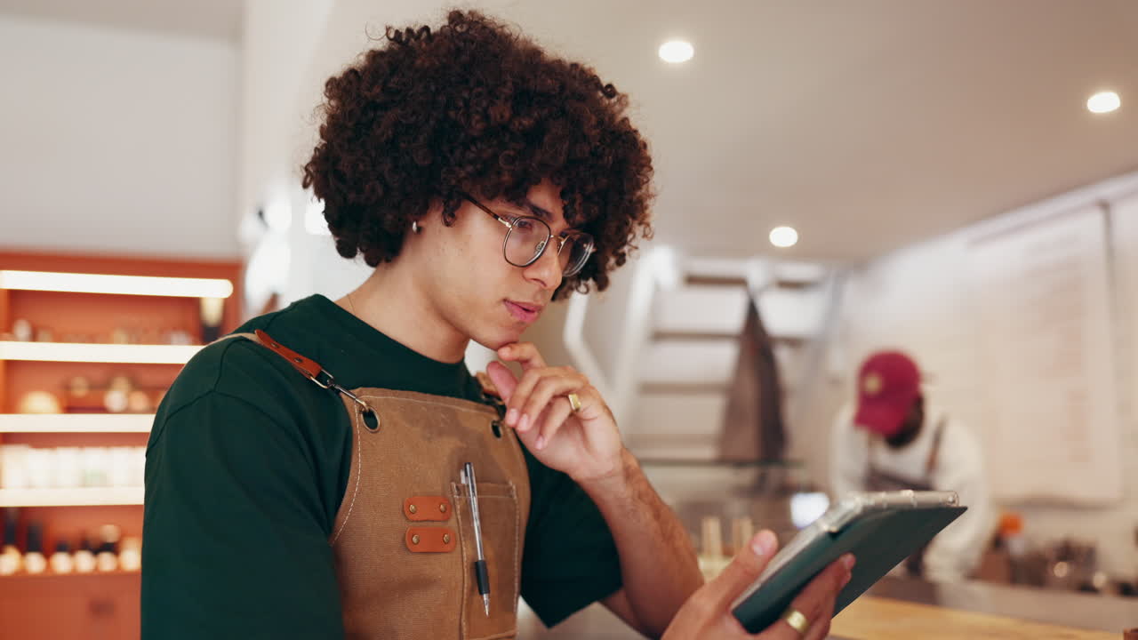 Man using tablet in cafe