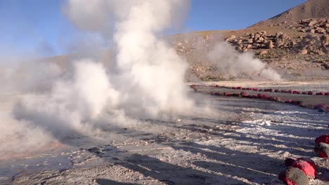 el tatio geysers eruption in the atacama desert in chile, south america