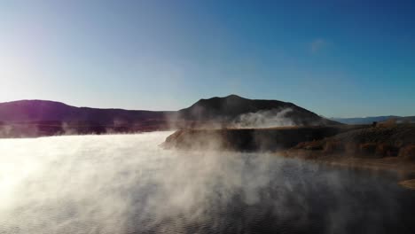 Dolly-in-shot-of-the-steam-on-the-water-at-Steamboat-Springs-Colorado,-USA