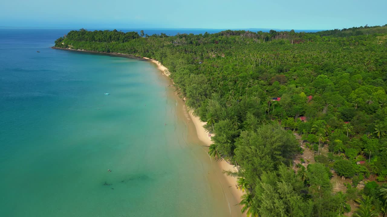 lonely beach with turquoise water and green forest in Koh Rong, Cambodia. Unbelievable aerial view flight overflight flyover drone