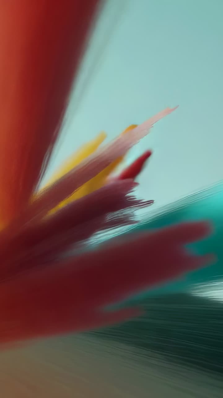 Vertical video: Opening brushstrokes sliding and forming yellow red pink teal peaks in digital art