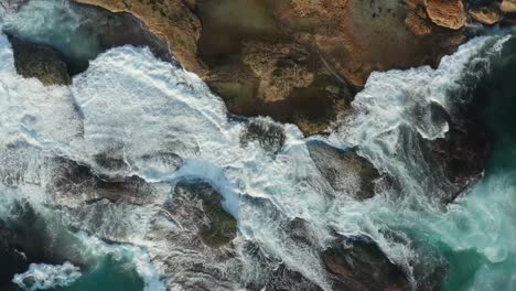 Waves-breaking-over-rocks-at-low-tide-Sydney-Australia-beach