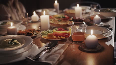 a plate of pasta soup is placed on a festively served table.