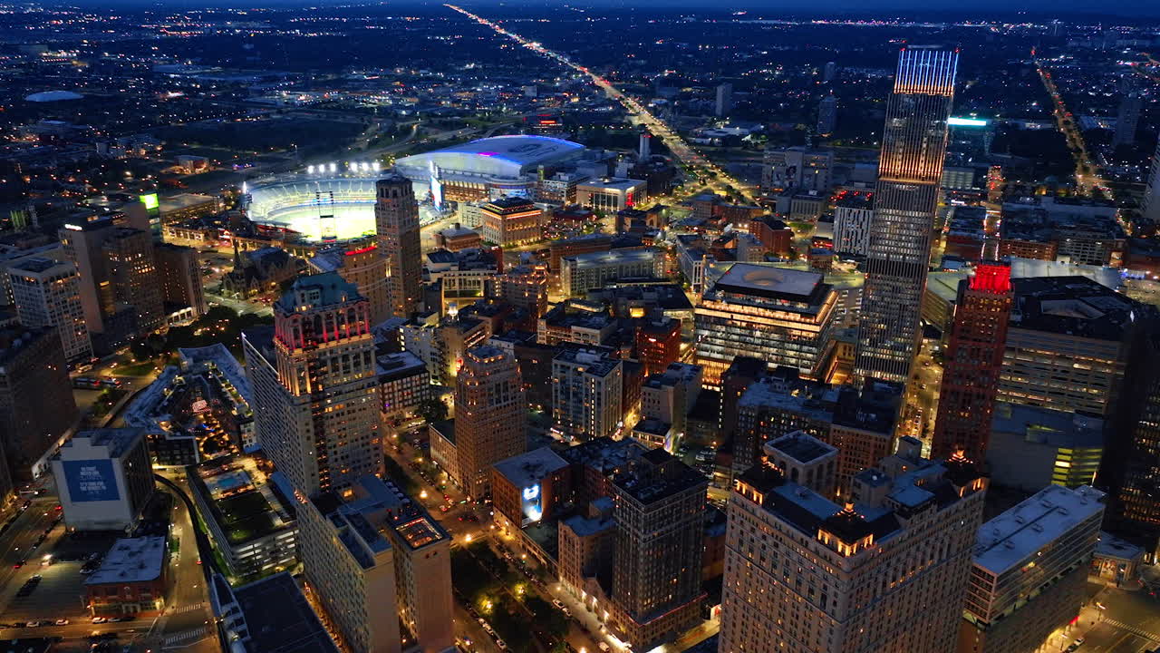 Detroit, USA, 28 July 2025: Detroit downtown lights at night. Glowing night skyline of Detroit with stadiums and busy illuminated streets below