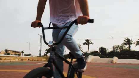 bmx rider free wheeling utilising the momentum of the bike for movement