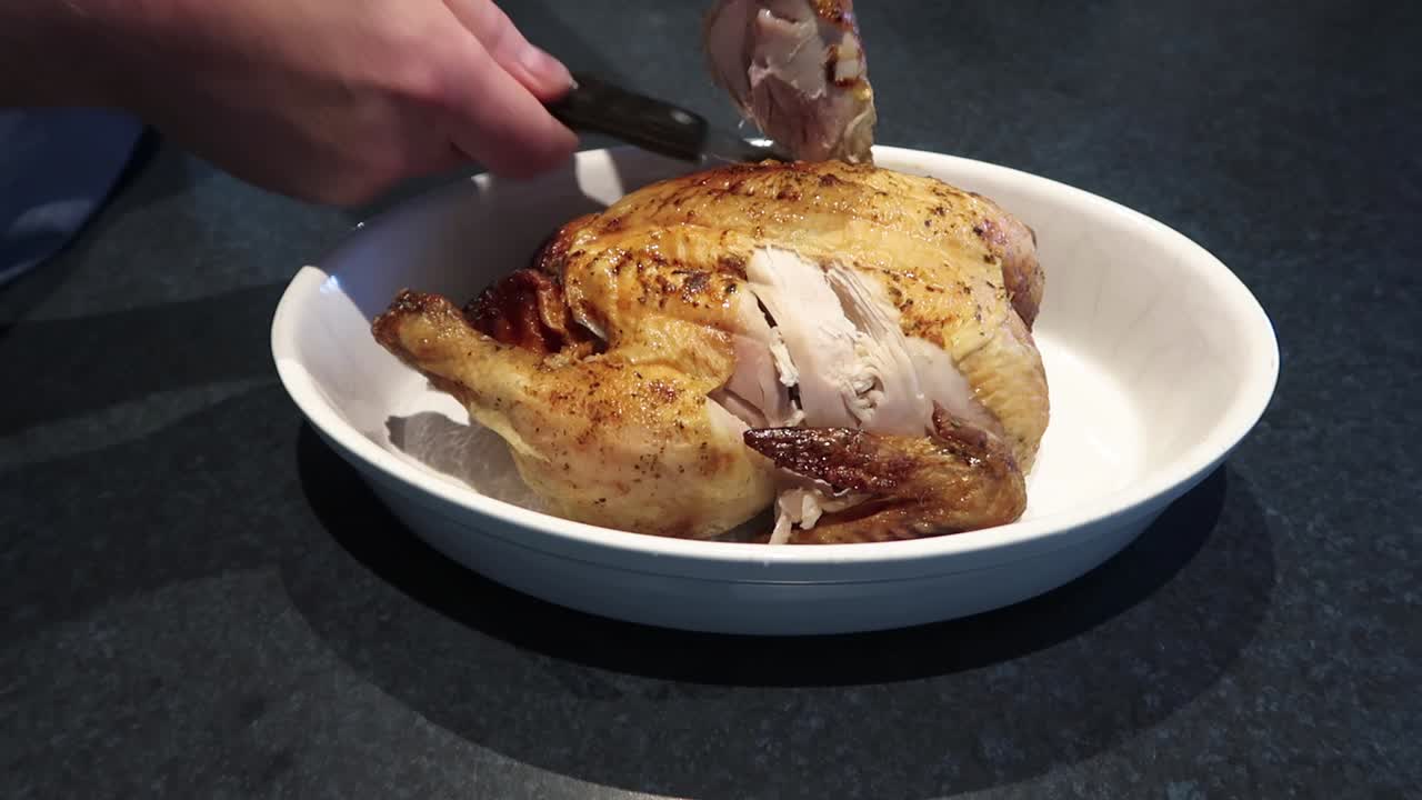 Carving legs of a fried chicken