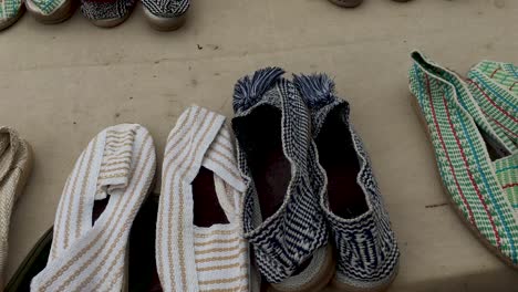 right gimbal shot of handmade espadrilles at flea market