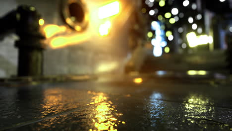 urban nighttime alley with reflections and glowing lights from buildings