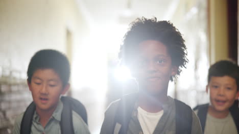 students walking in school hallway