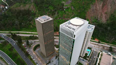 aerial orbit over the santa maria towers in santiago chile, comparison of modern and contemporary architecture, discontinued design