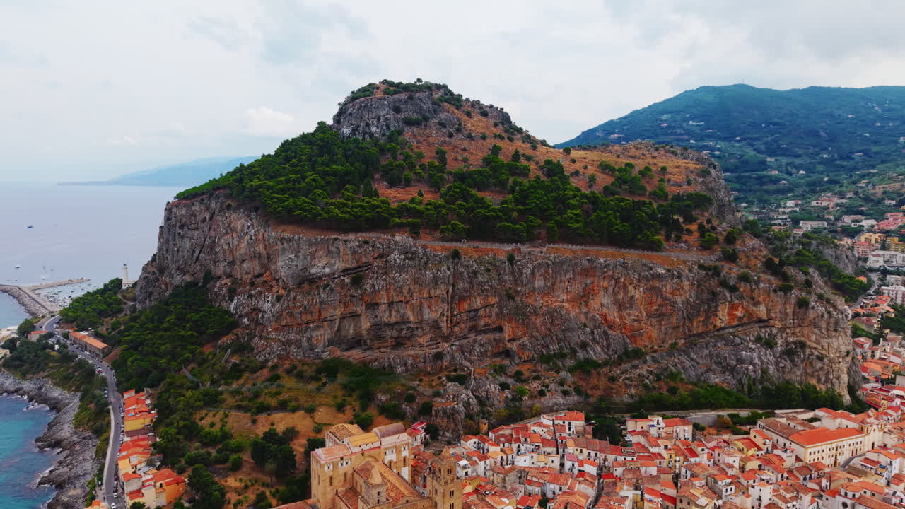 Aerial view of Cefalù, Sicily showing rocky hill and coastline