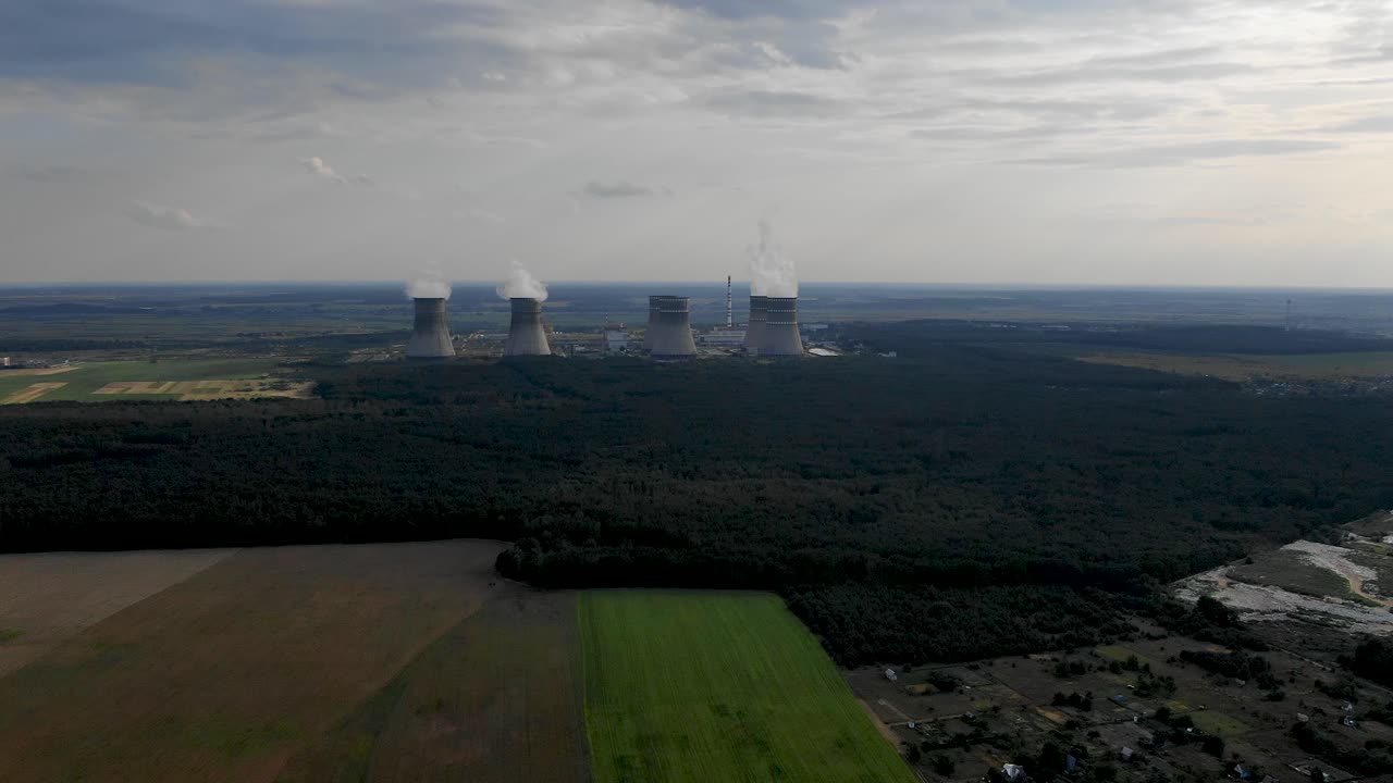 Aerial drone push-in tracking shot of a nuclear power plant in Ukraine