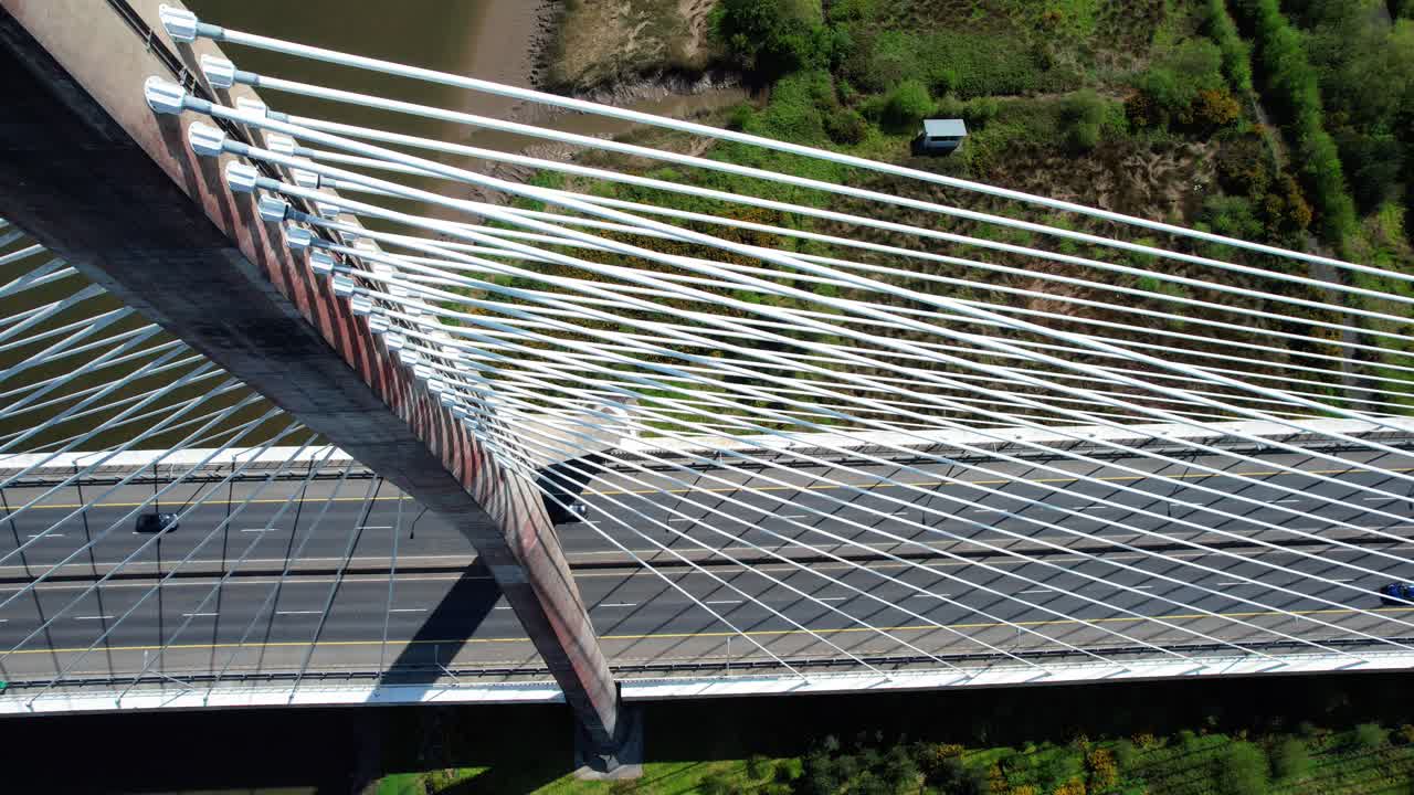 Drone looking down on to suspension pylon and cablestays impressive engineering on bypass bridge in Waterford Ireland elegant design