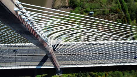 drone looking down on to suspension pylon and cablestays impressive engineering on bypass bridge in waterford ireland elegant design