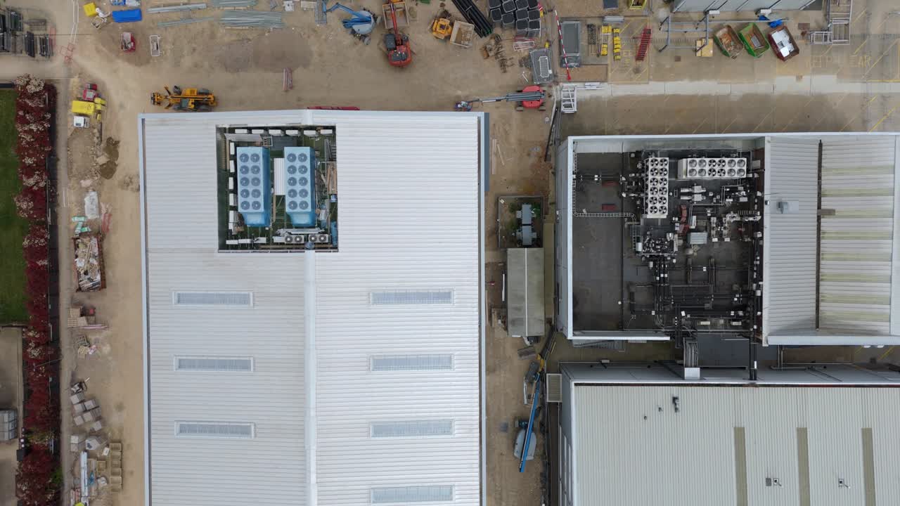 UK industrial zone from the sky showing warehouses logistics centres and data centre fans cooling computers