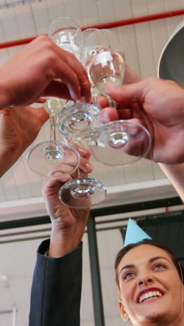 business executives toasting glasses of champagne